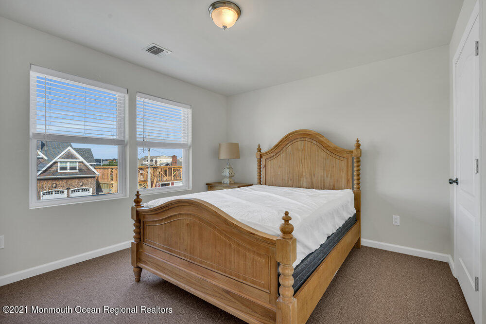 32 Niblick Street Point Pleasant Beach, NJ 08742 - Photo 30 of 38 a bedroom with a bed and window
