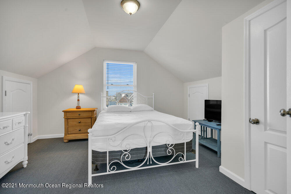 32 Niblick Street Point Pleasant Beach, NJ 08742 - Photo 35 of 38 a bedroom with a bed and a tv