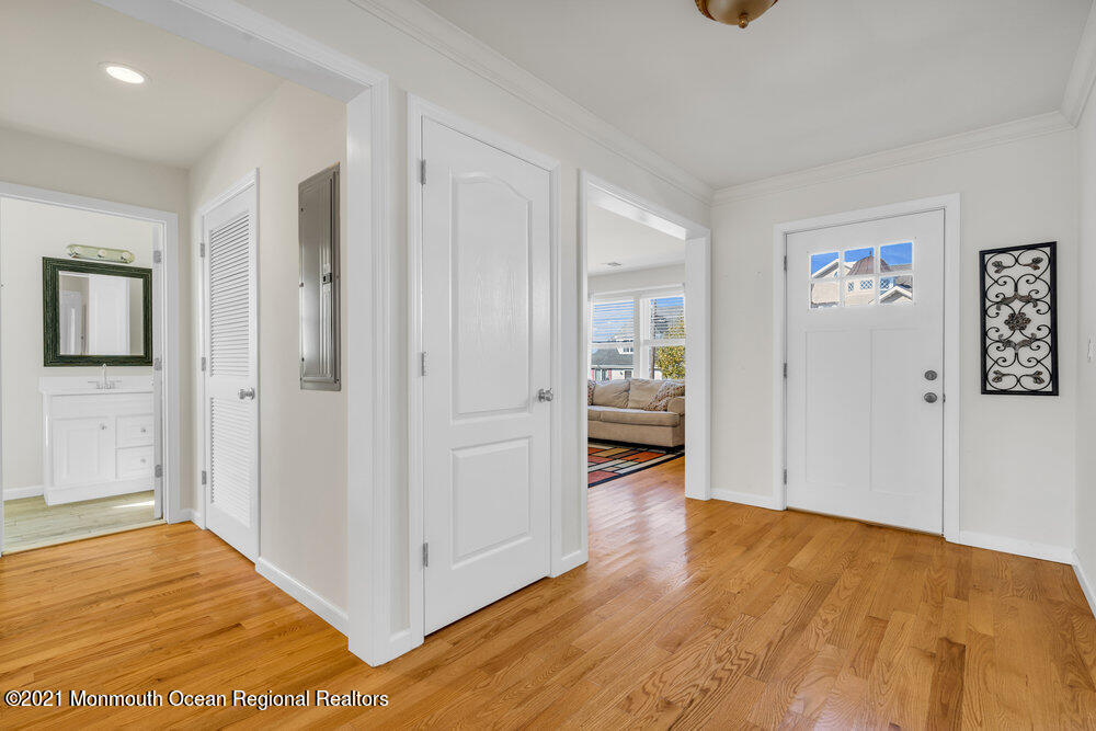 32 Niblick Street Point Pleasant Beach, NJ 08742 - Photo 9 of 38 a view of a room with wooden floor and a bathroom