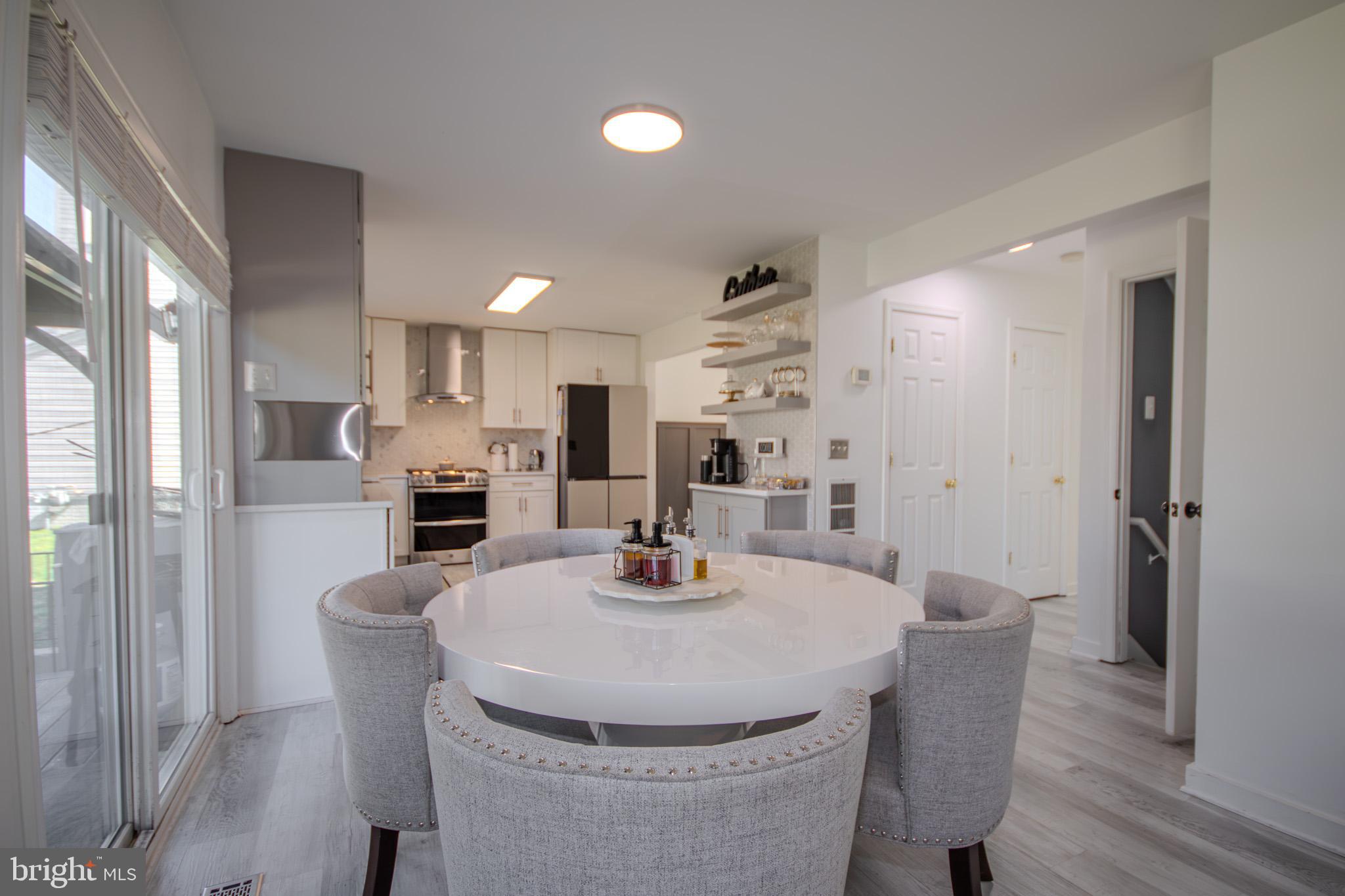 1519 Anchors Way Salisbury, MD 21801 - Photo 11 of 49 a kitchen with a dining table and chairs