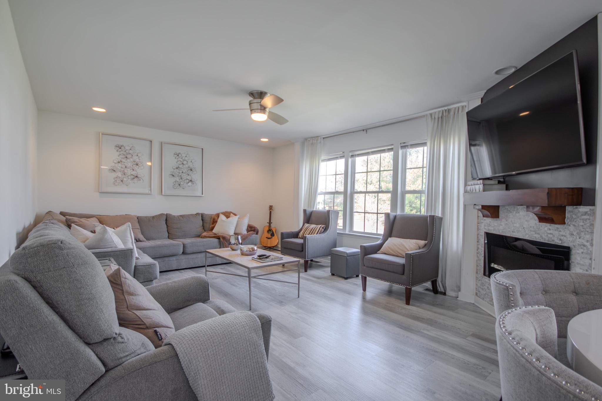 1519 Anchors Way Salisbury, MD 21801 - Photo 12 of 49 a living room with furniture and a flat screen tv