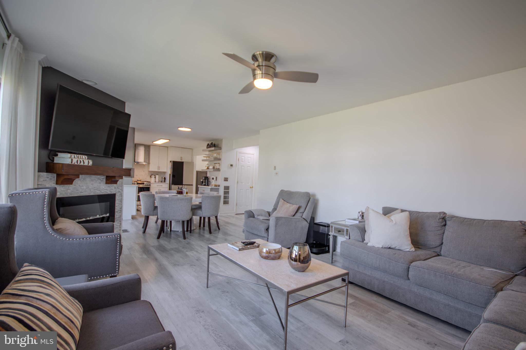 1519 Anchors Way Salisbury, MD 21801 - Photo 13 of 49 a living room with furniture kitchen view and a flat screen tv