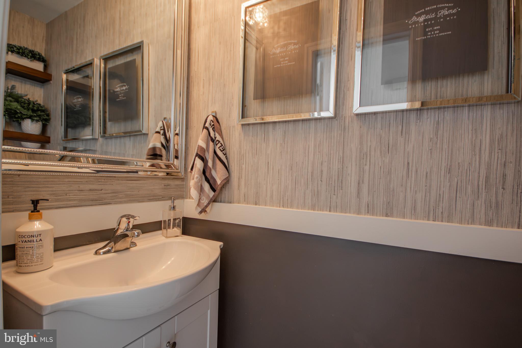1519 Anchors Way Salisbury, MD 21801 - Photo 15 of 49 a bathroom with a sink and a mirror