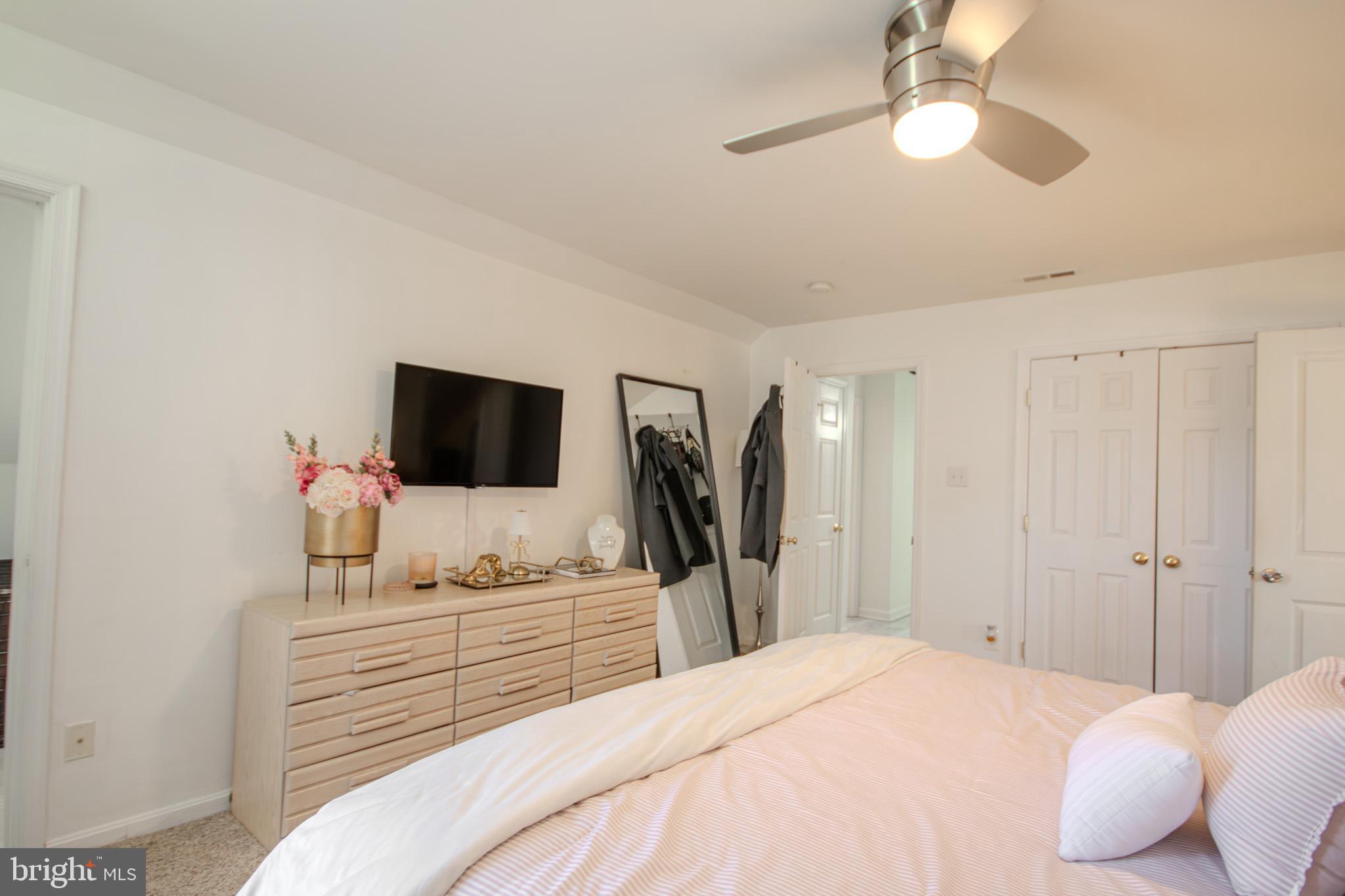 1519 Anchors Way Salisbury, MD 21801 - Photo 17 of 49 a bedroom with a bed and a flat tv screen