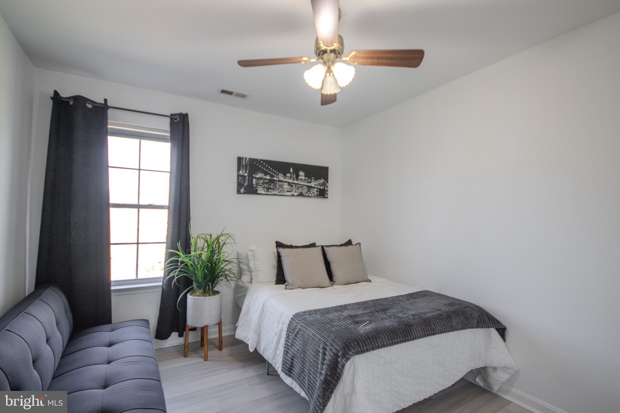 1519 Anchors Way Salisbury, MD 21801 - Photo 27 of 49 a bedroom with a bed and a large window