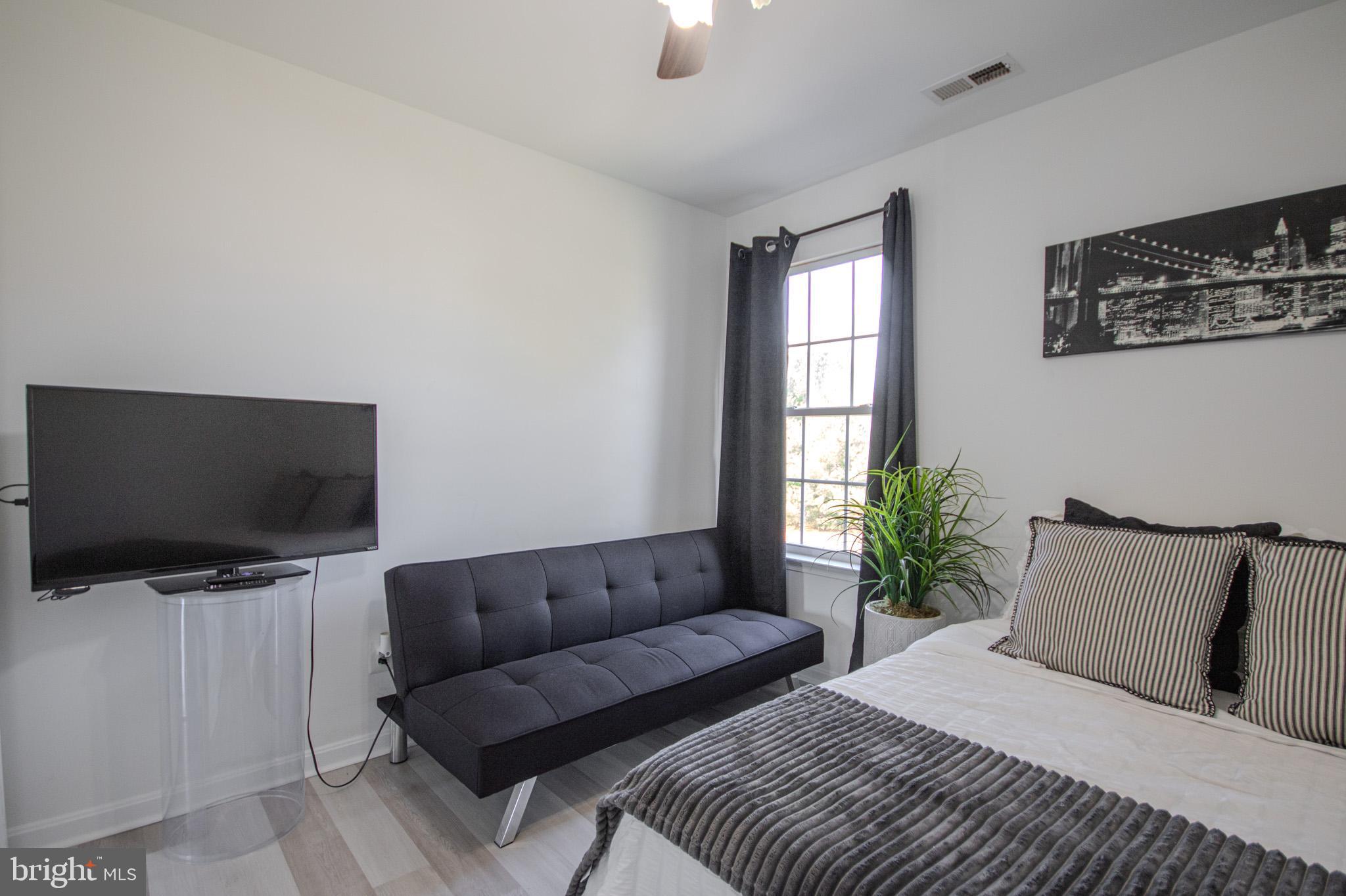 1519 Anchors Way Salisbury, MD 21801 - Photo 28 of 49 a living room with furniture and a flat screen tv