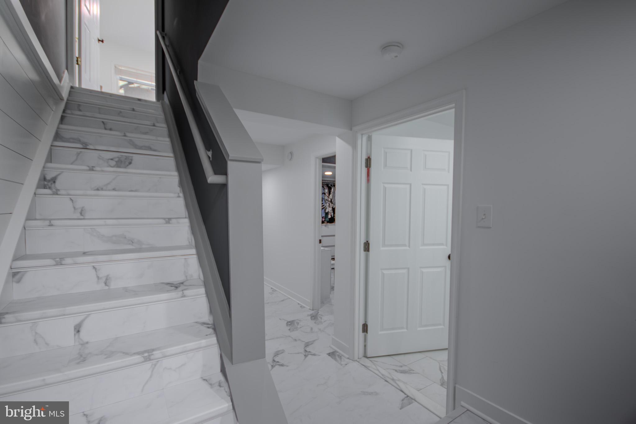 1519 Anchors Way Salisbury, MD 21801 - Photo 30 of 49 a view of staircase with white walls and door