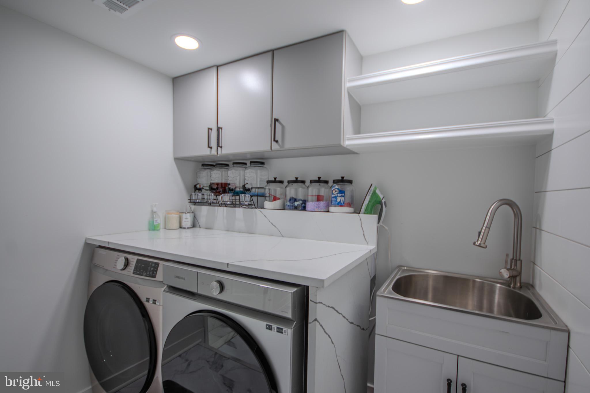 1519 Anchors Way Salisbury, MD 21801 - Photo 31 of 49 a utility room with sink dryer and washer