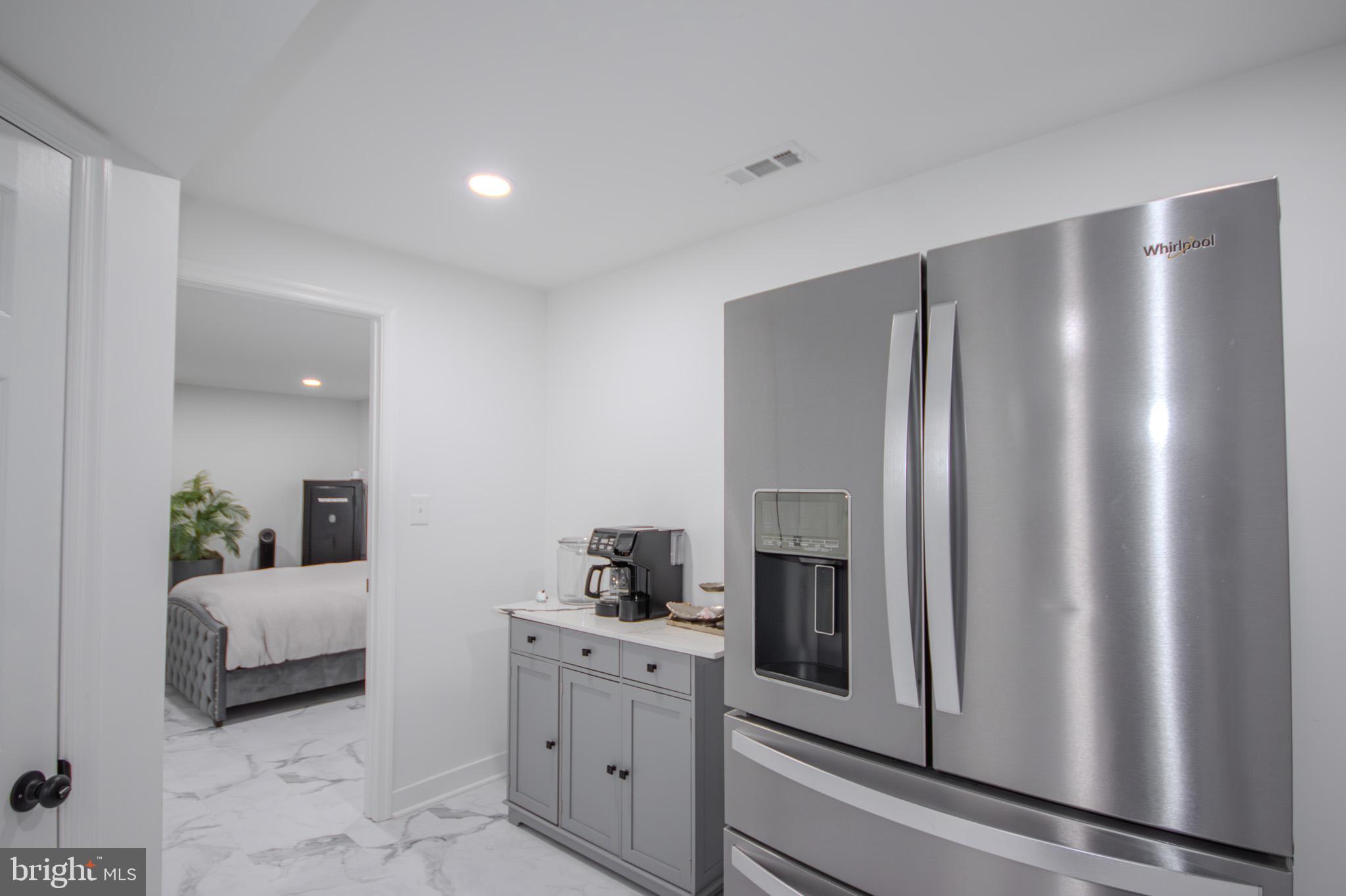 1519 Anchors Way Salisbury, MD 21801 - Photo 36 of 49 a spacious bedroom with a bed and a couch