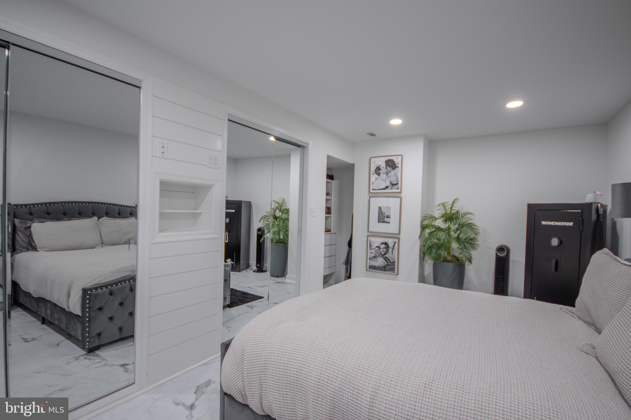 1519 Anchors Way Salisbury, MD 21801 - Photo 38 of 49 a bedroom with a bed and a large mirror