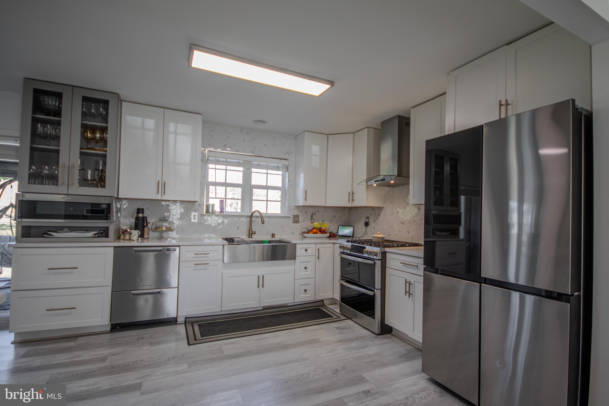 1519 Anchors Way Salisbury, MD 21801 - Photo 8 of 49 a kitchen with a refrigerator stove and sink