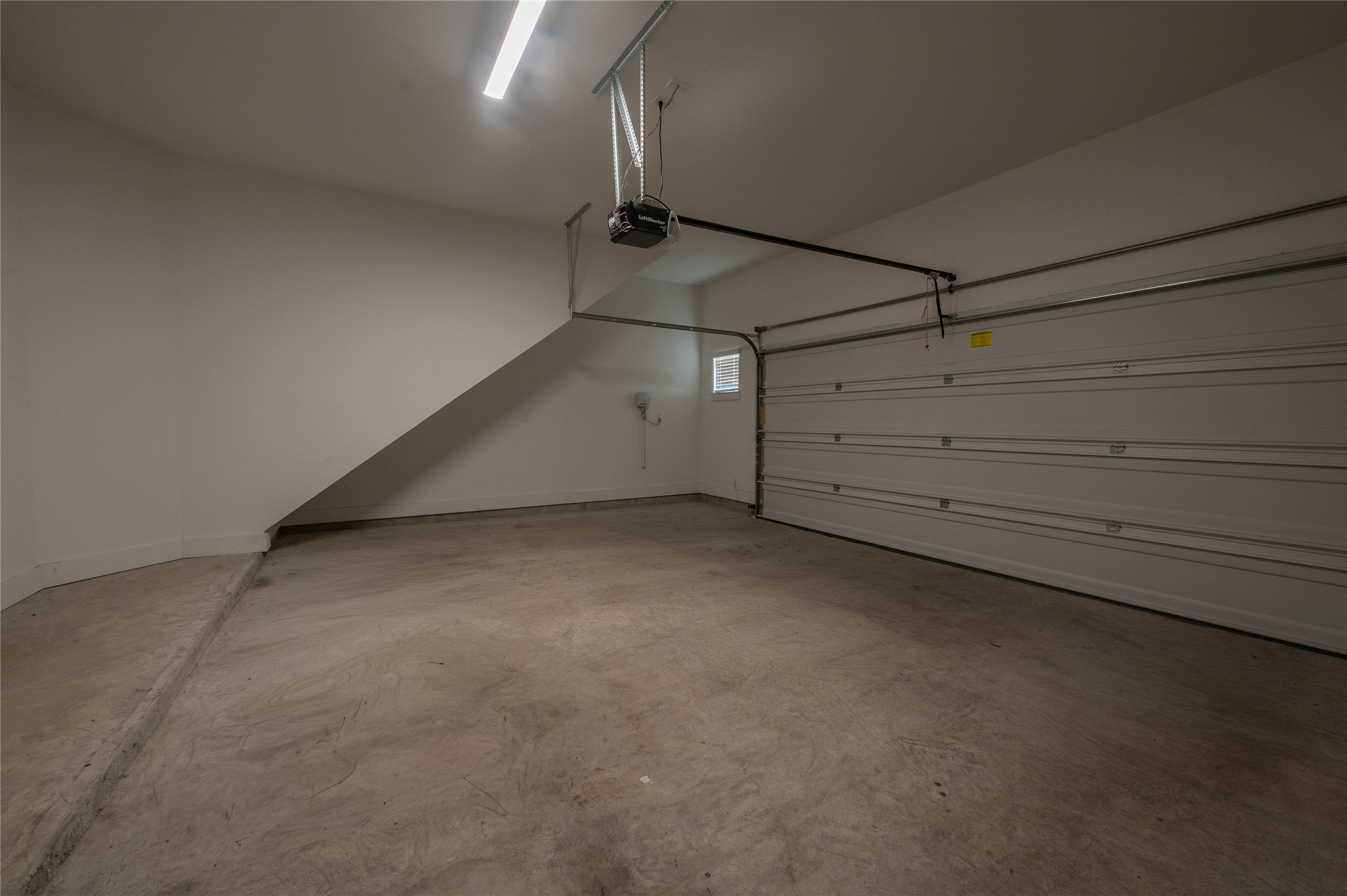 963 Lilly Flower Lane Houston, TX 77091 - Photo 24 of 28 Extra wide garage for large vehicles or storage, with 10ft ceiling