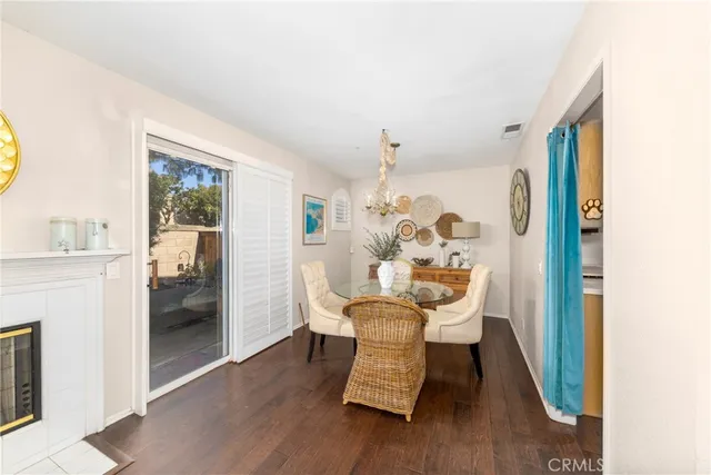 a dining room with furniture and wooden floor