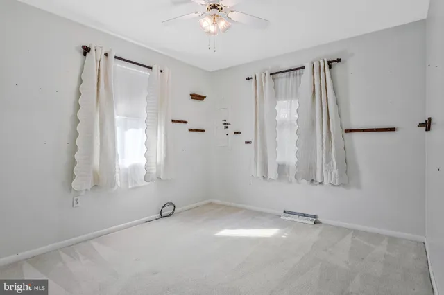 a bathroom with a sink toilet a mirror and shower