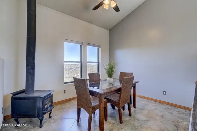 a view of a dining room with furniture and window