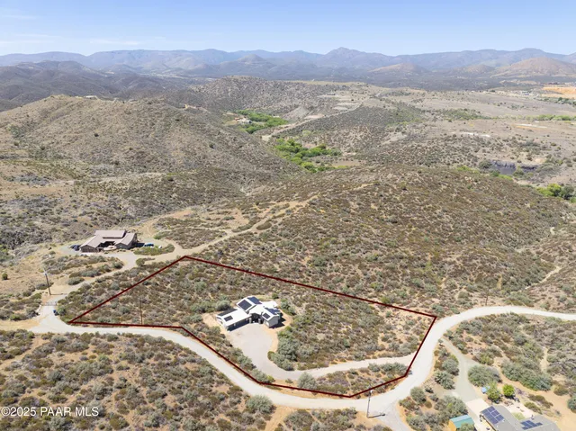 a view of a mountain from a yard