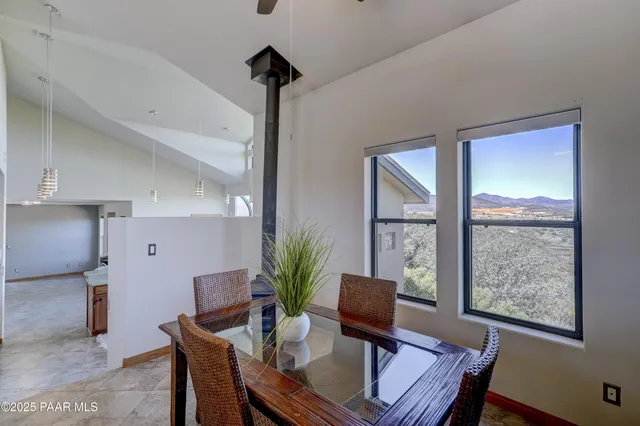 a view of a livingroom with furniture and a potted plant