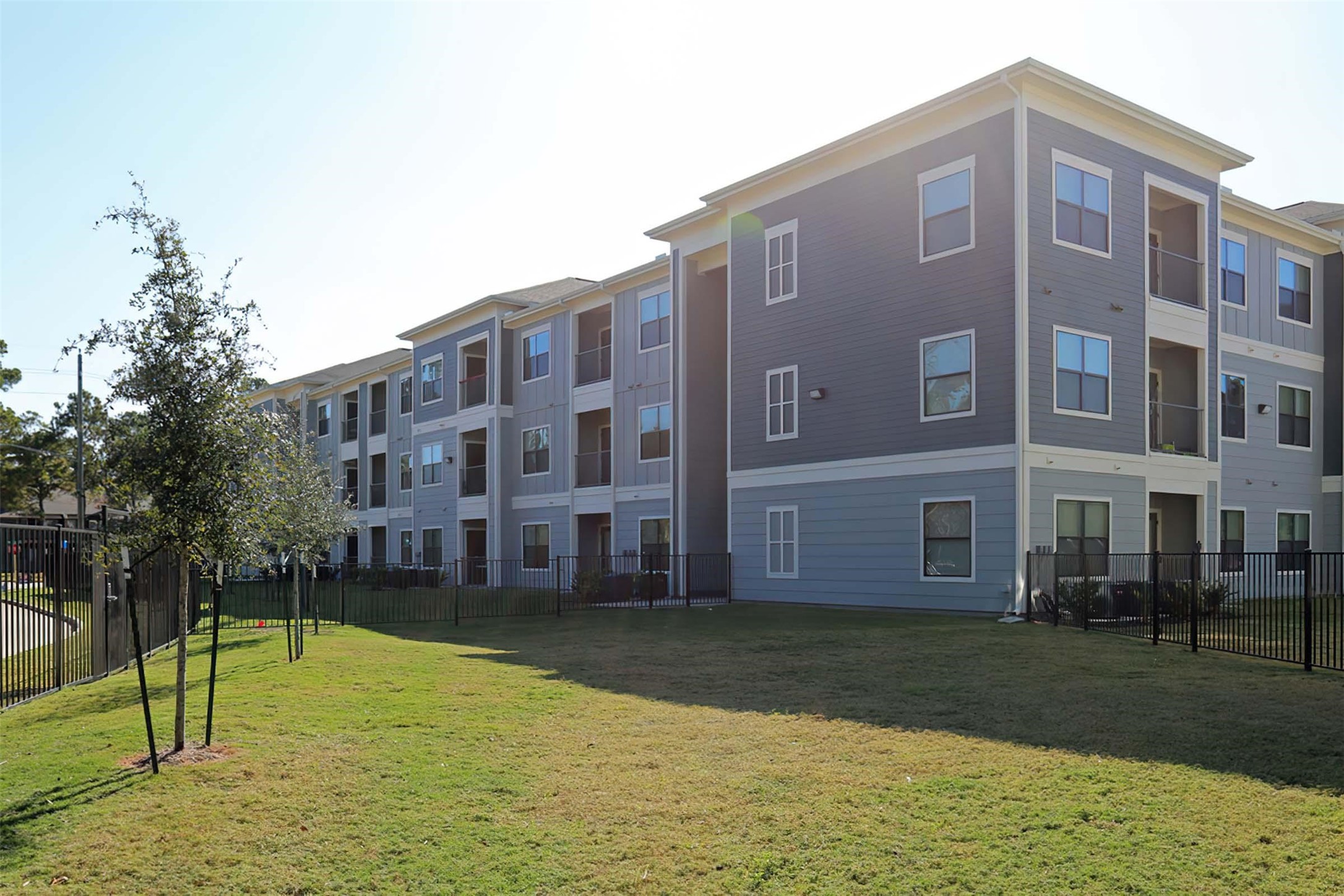 4604 Cypresswood Drive, Unit 1104 Spring, TX 77379 - Photo 23 of 29 a view of a house with a yard
