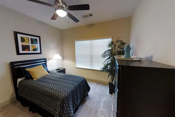 a view of a hallway with workspace and a living room