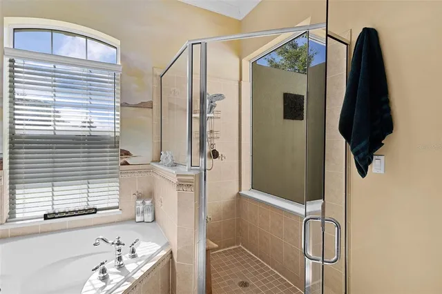 a bathroom with a sink mirror toilet and shower