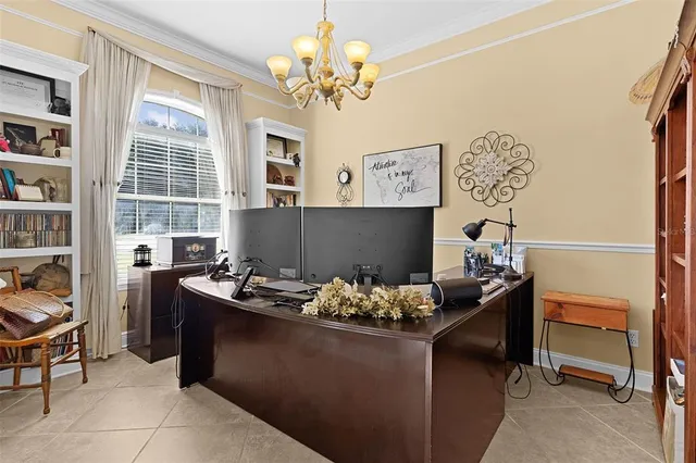 a view of a house with a yard and sitting area