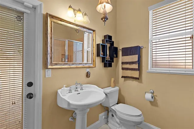 a view of a patio with a table and chairs under an umbrella