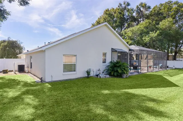 a front view of a house with yard and green space