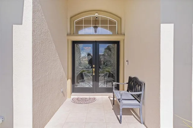 a living room with furniture fireplace and a chandelier