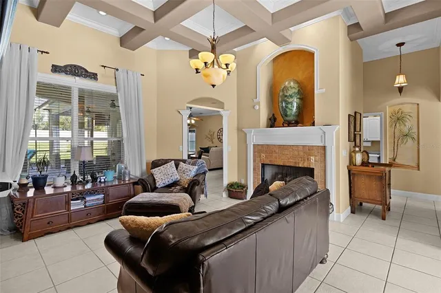 a view of a dining room with furniture and a chandelier