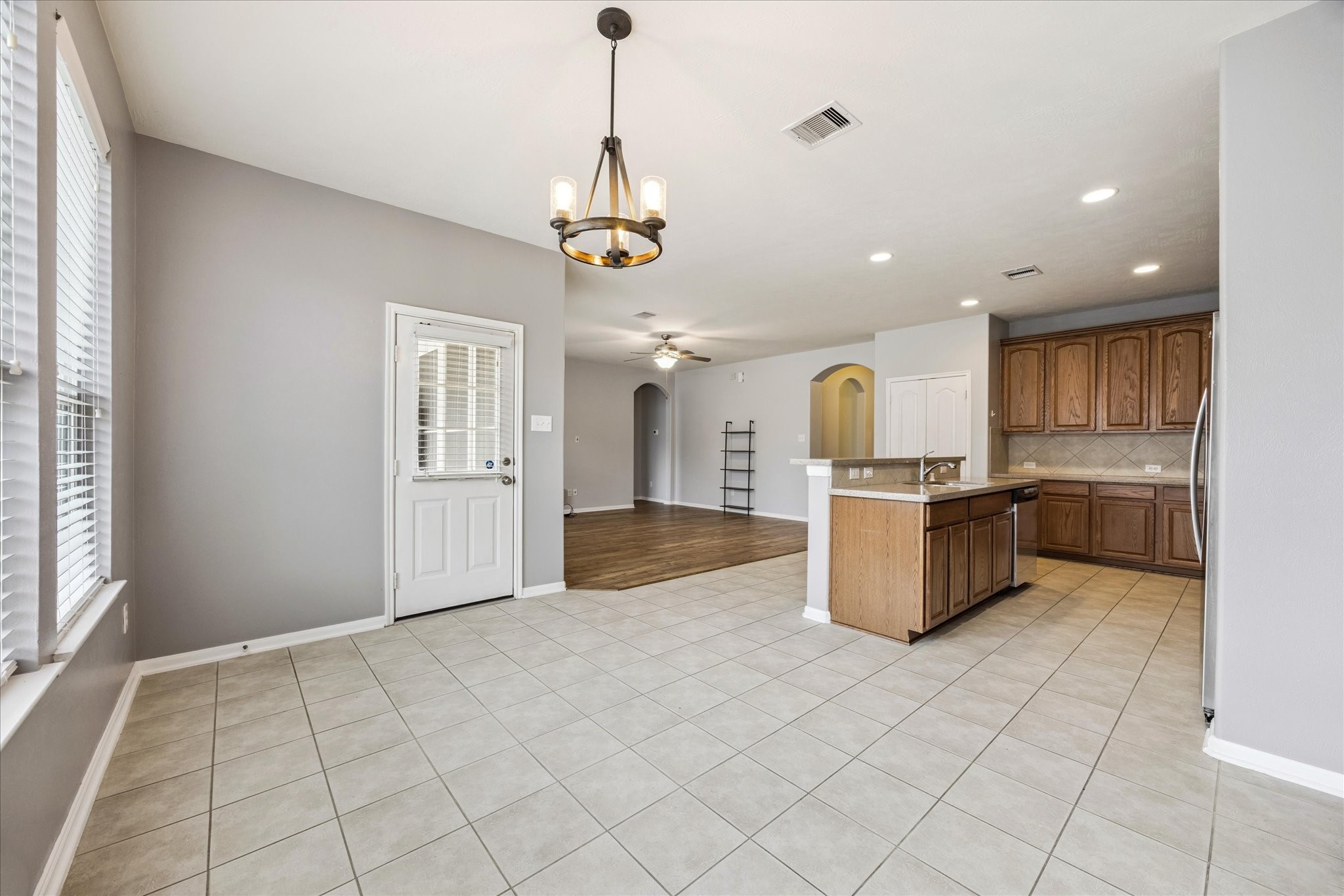 8506 Sweetstone Field Court Cypress, TX 77433 - Photo 11 of 33 a view of kitchen with granite countertop stove top oven and cabinets