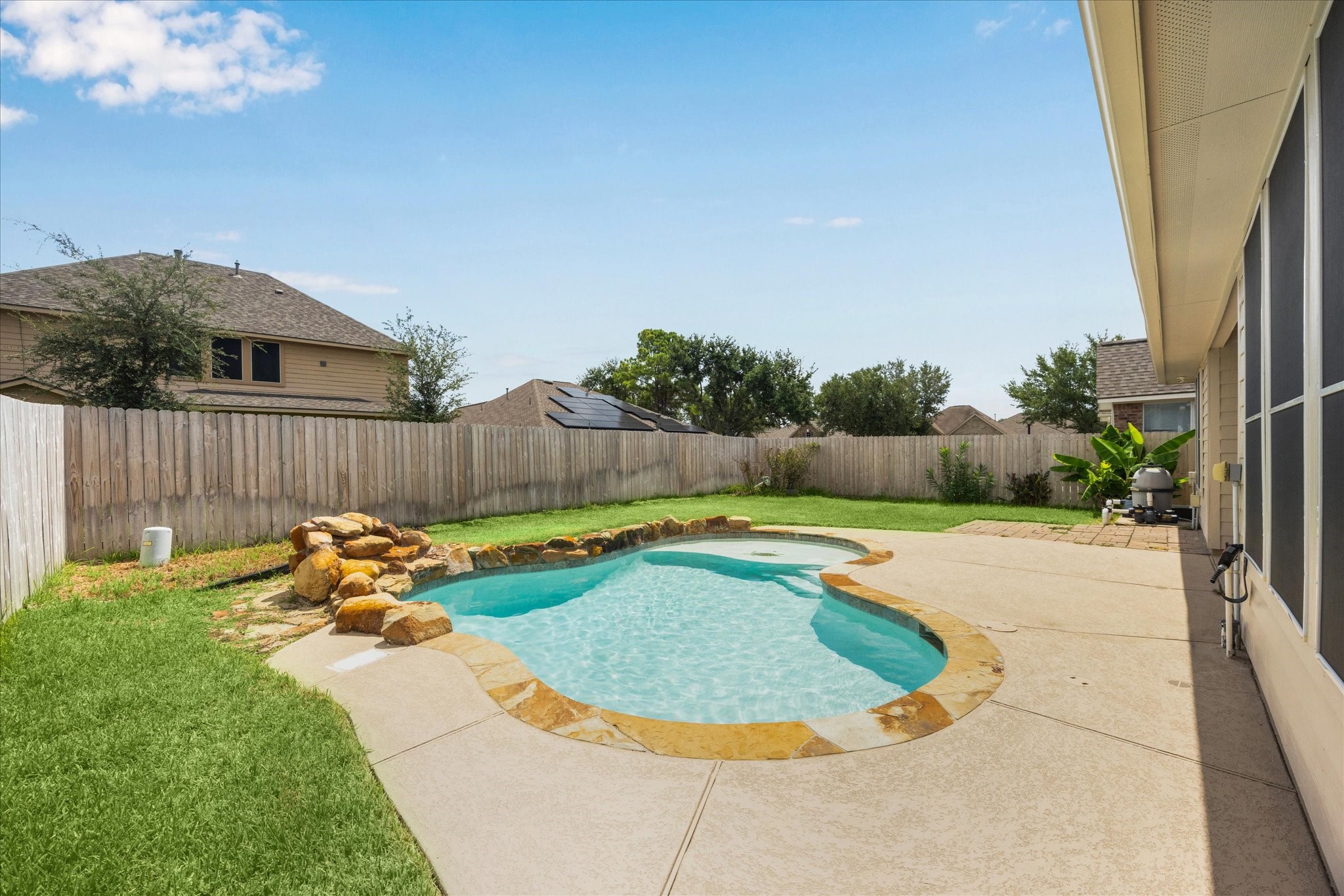 8506 Sweetstone Field Court Cypress, TX 77433 - Photo 28 of 33 a view of a backyard with swimming pool and furniture