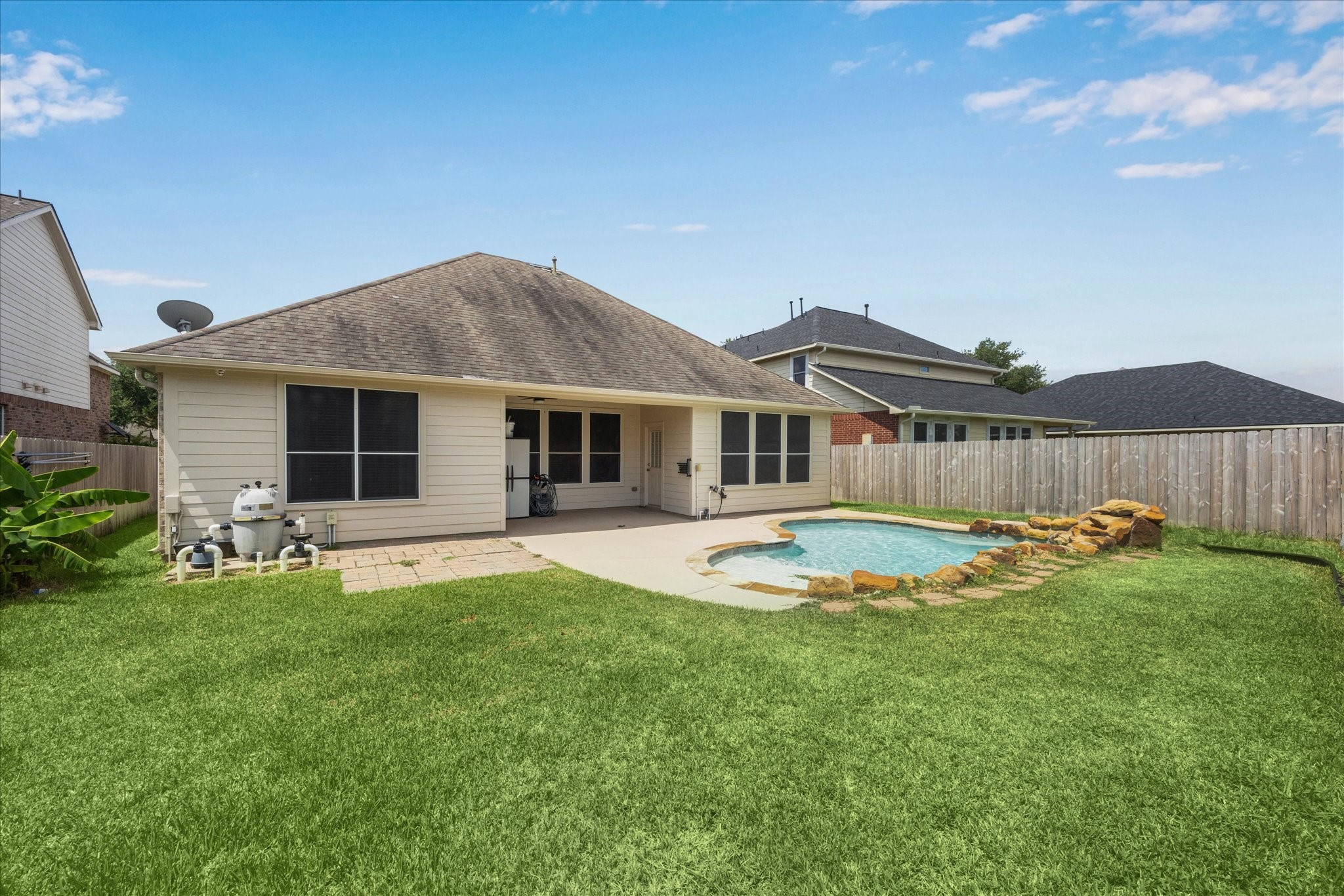 8506 Sweetstone Field Court Cypress, TX 77433 - Photo 30 of 33 a view of a house with backyard and sitting area