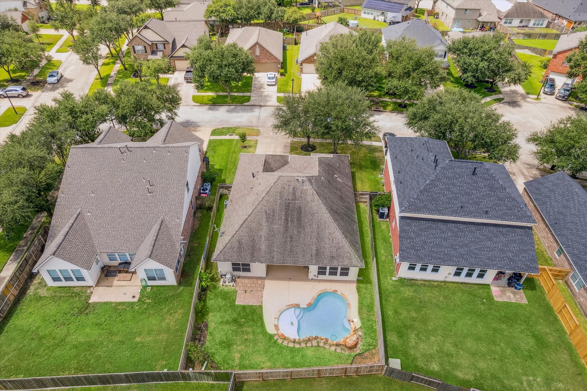 8506 Sweetstone Field Court Cypress, TX 77433 - Photo 31 of 33 an aerial view of multiple houses with yard