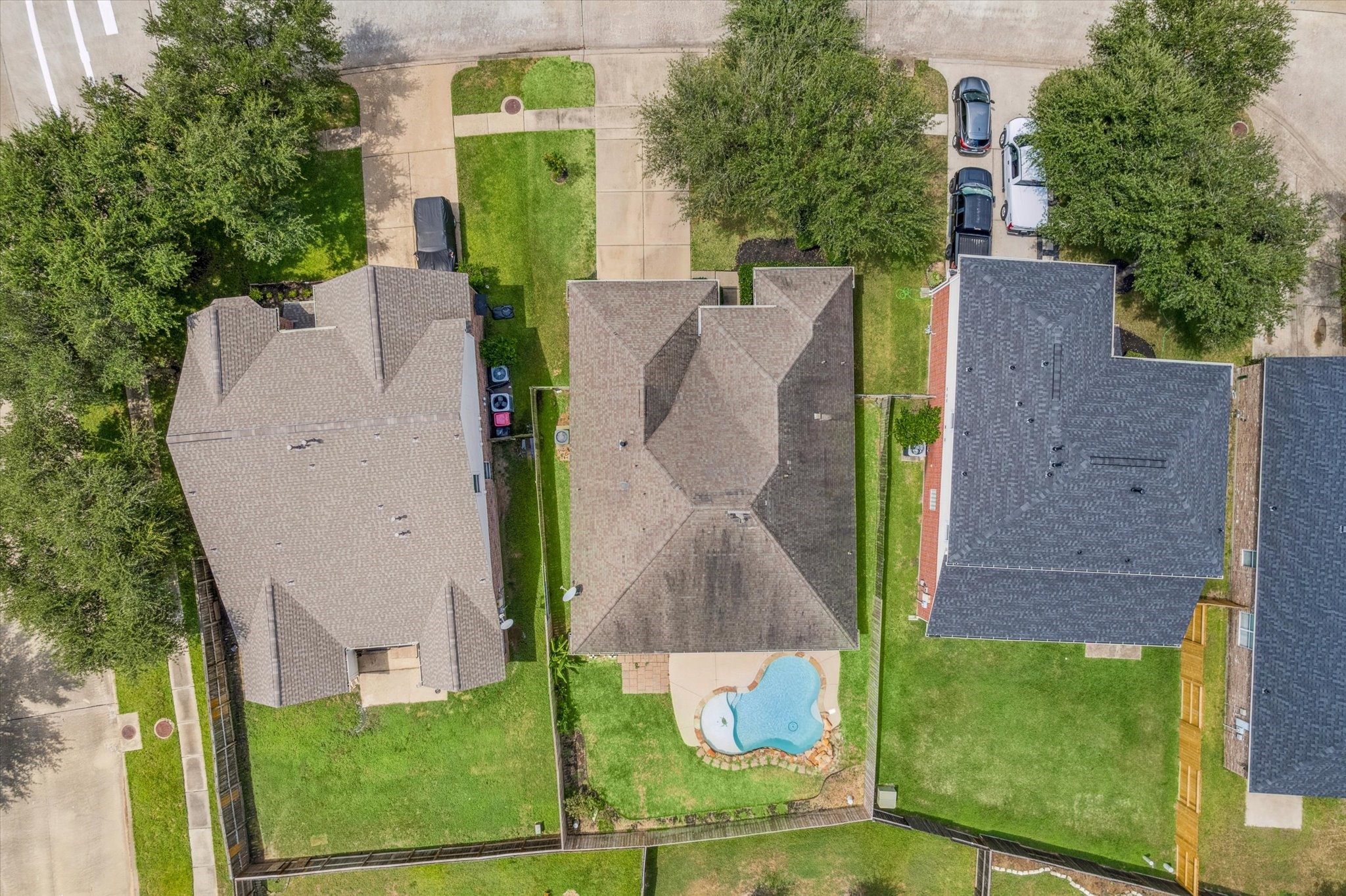 8506 Sweetstone Field Court Cypress, TX 77433 - Photo 32 of 33 an aerial view of a house with garden space and a car parked