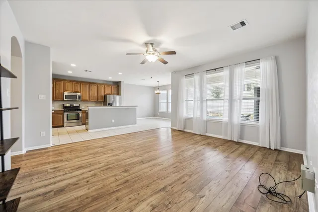 a view of a kitchen with a sink and a window