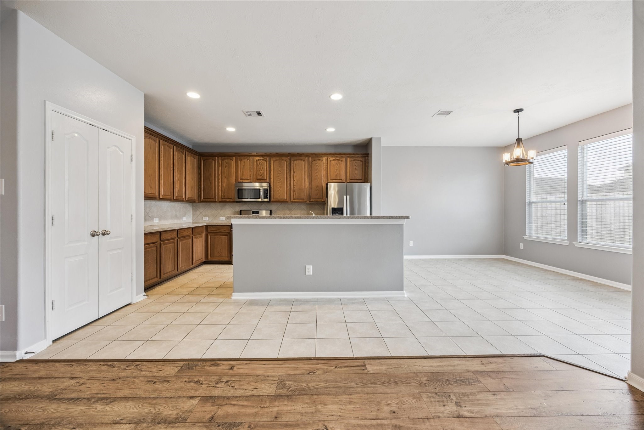 8506 Sweetstone Field Court Cypress, TX 77433 - Photo 8 of 33 a view of kitchen with granite countertop window and a refrigerator