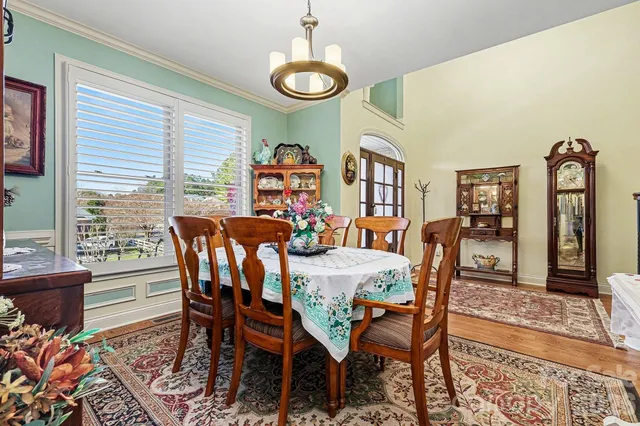 a bedroom with a bed dresser and a window