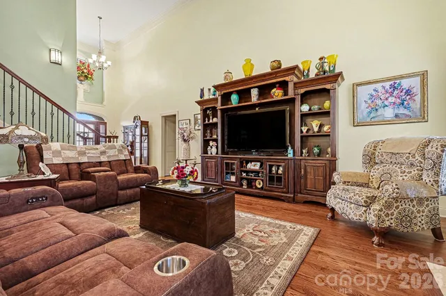 a kitchen with stainless steel appliances kitchen island granite countertop a refrigerator and a sink