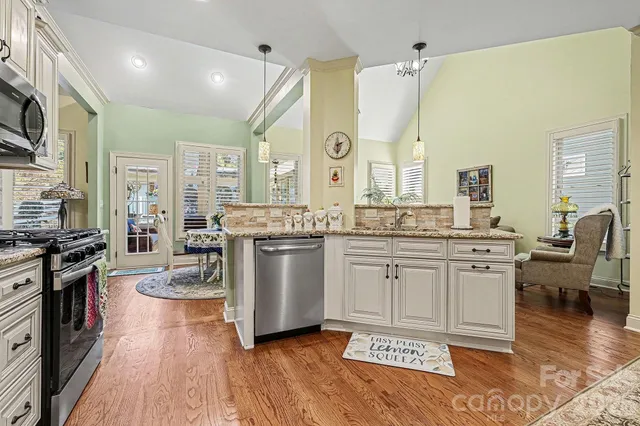 a bedroom with a large bed and a couch