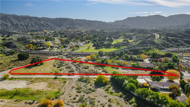 a view of a park with an outdoor seating