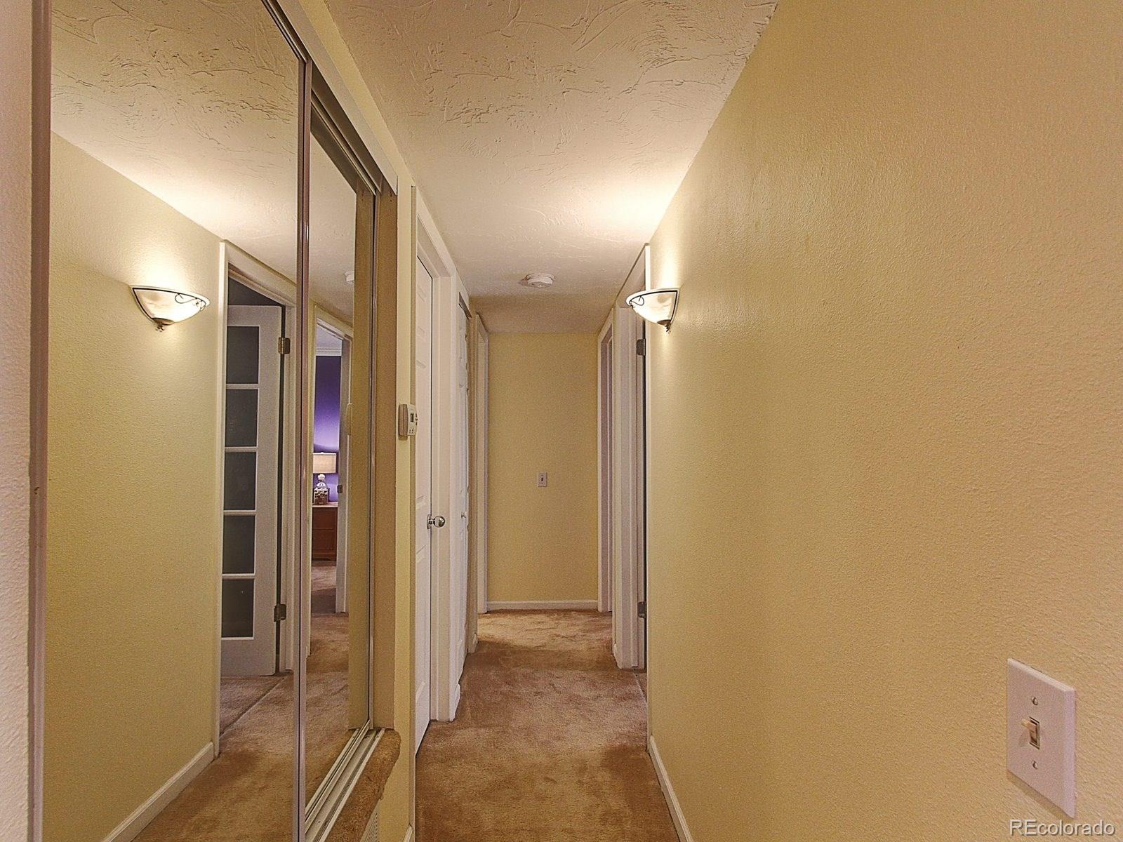 6410 South Dayton Street, Unit I08 Englewood, CO 80111 - Photo 15 of 32 a view of a hallway