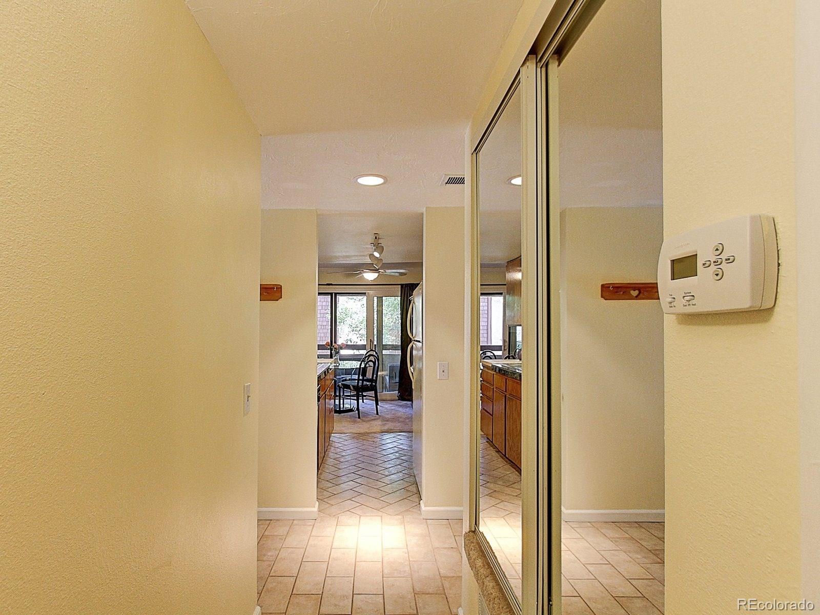 6410 South Dayton Street, Unit I08 Englewood, CO 80111 - Photo 16 of 32 a bathroom with a glass shower door