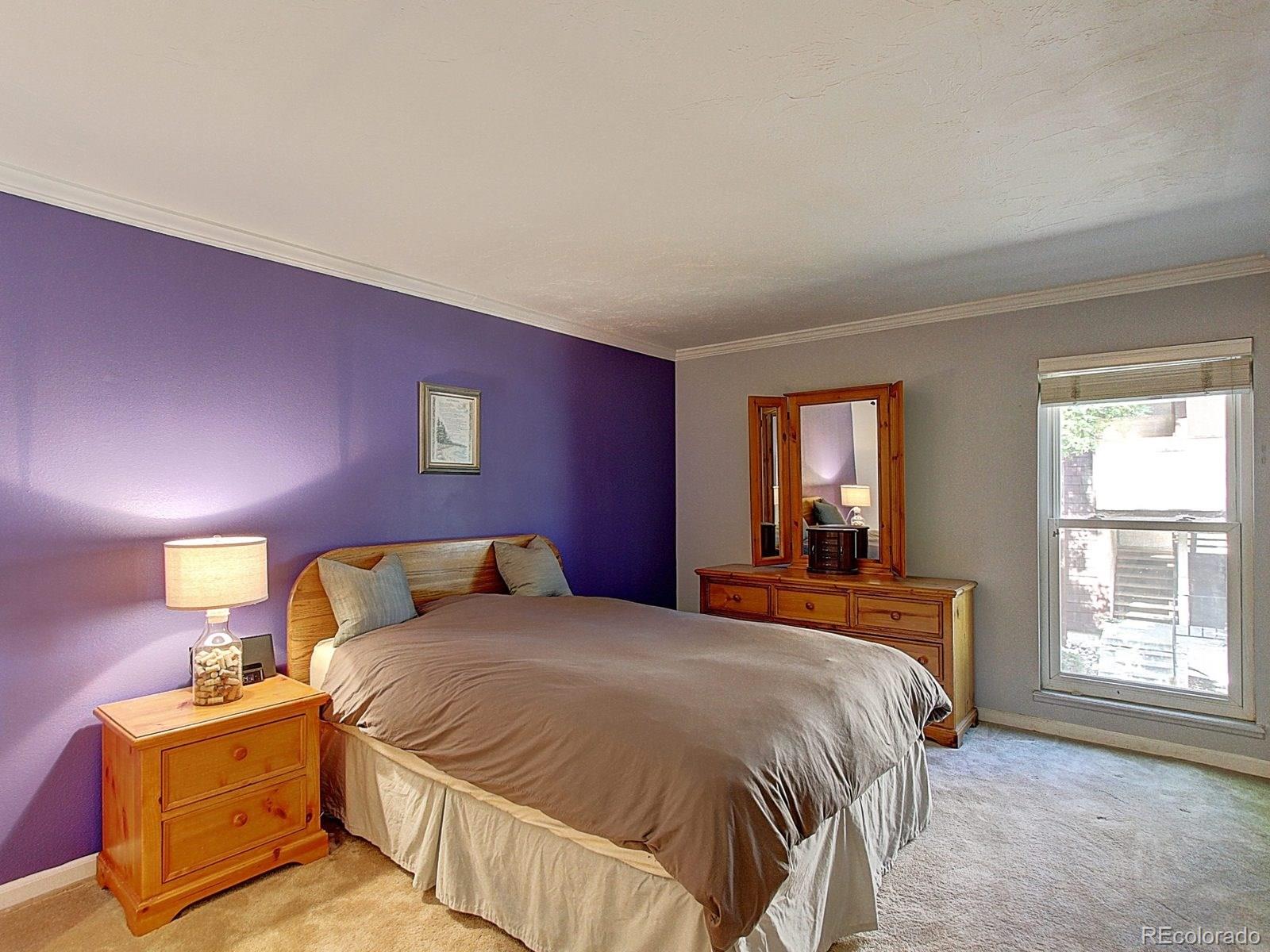 6410 South Dayton Street, Unit I08 Englewood, CO 80111 - Photo 17 of 32 a bedroom with a bed and window