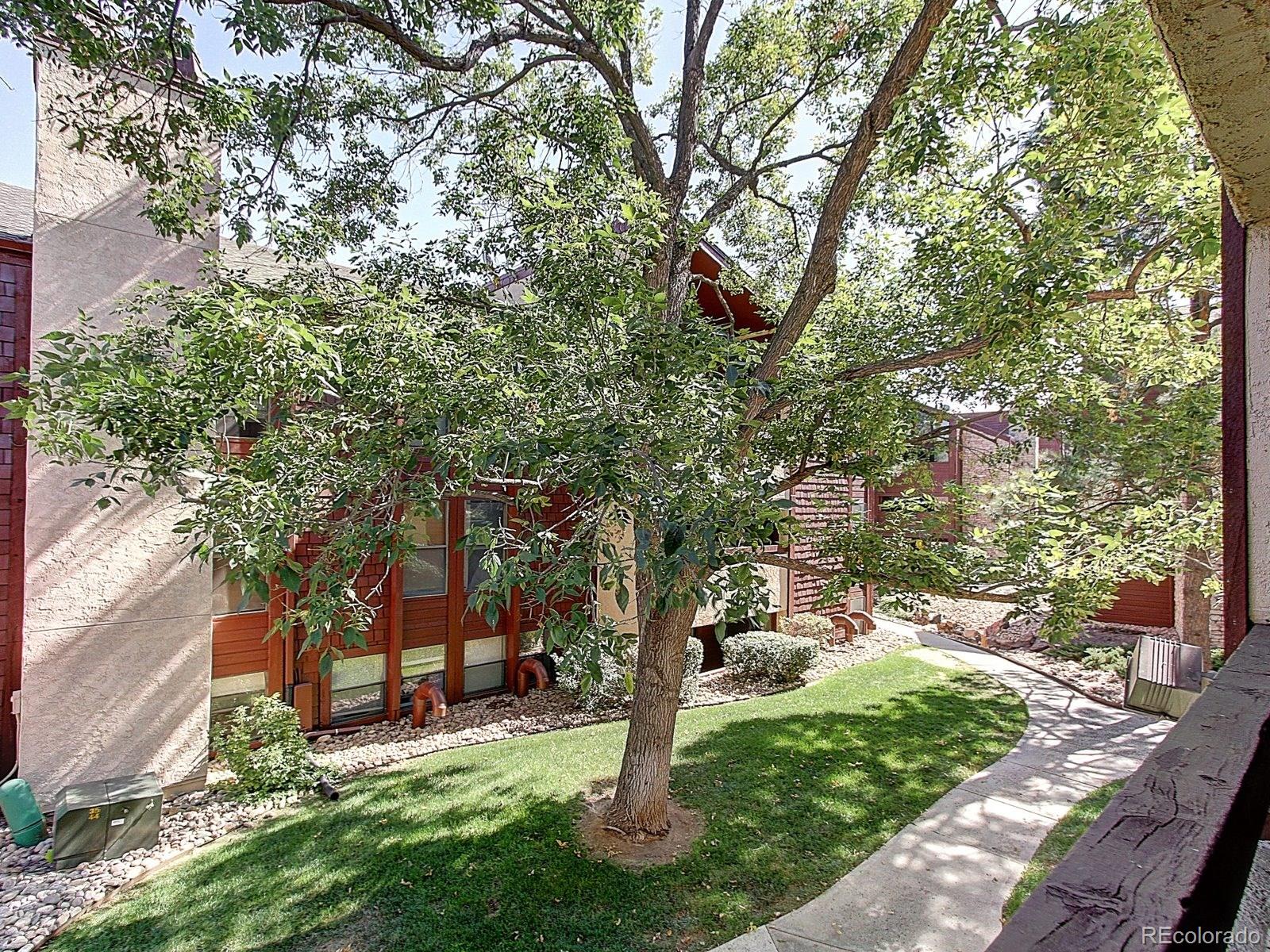 6410 South Dayton Street, Unit I08 Englewood, CO 80111 - Photo 24 of 32 a view of a park with large trees