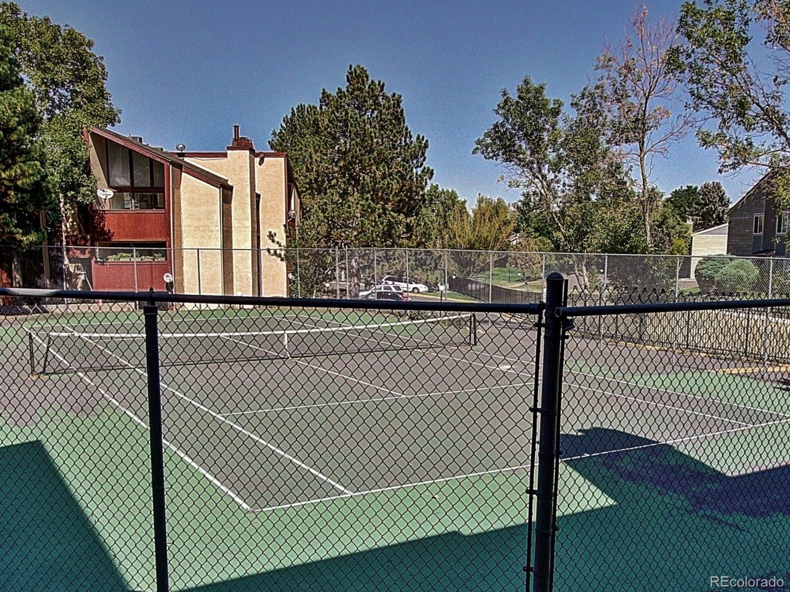 6410 South Dayton Street, Unit I08 Englewood, CO 80111 - Photo 28 of 32 a view of a building from a gate