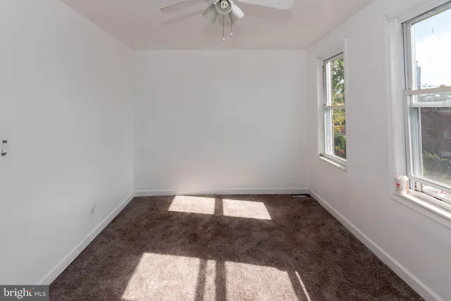 a view of an empty room and window