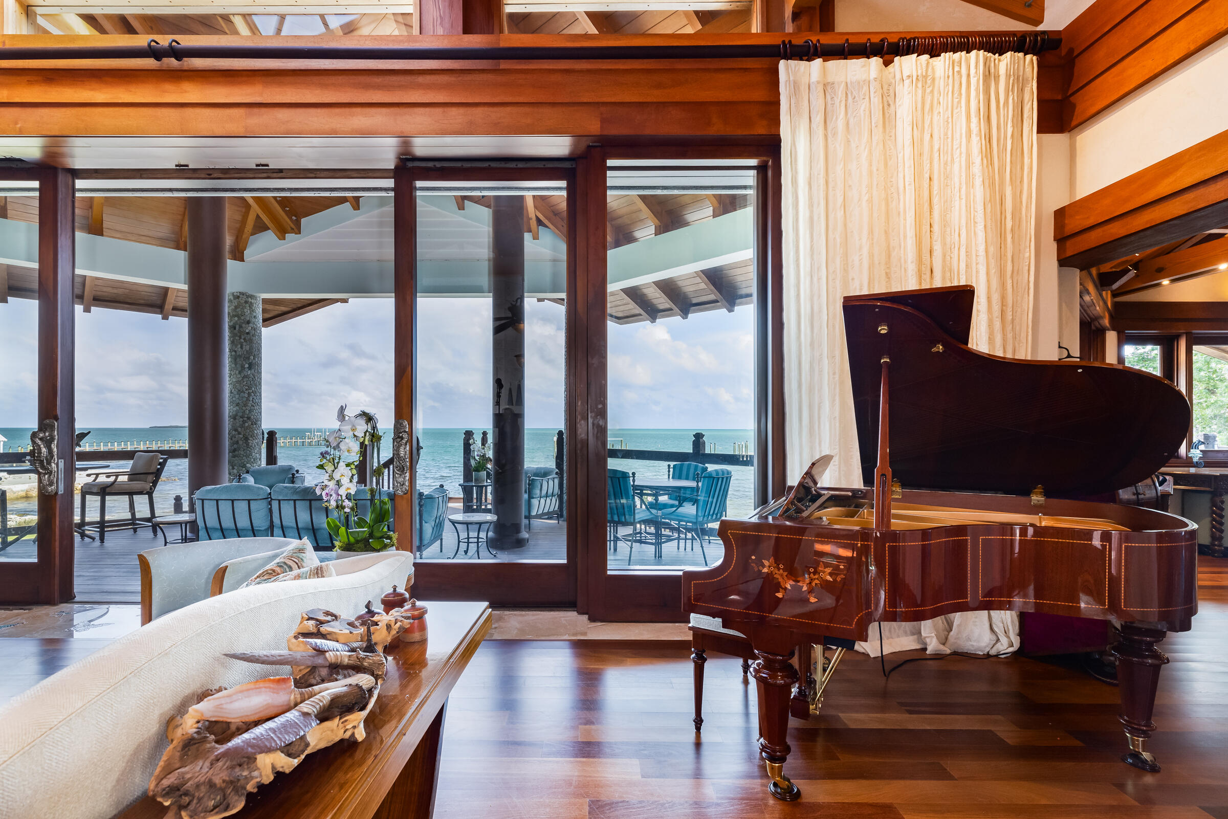 89301 Old State Road Tavernier, FL 33070 - Photo 40 of 99 a living room with furniture and floor to ceiling windows