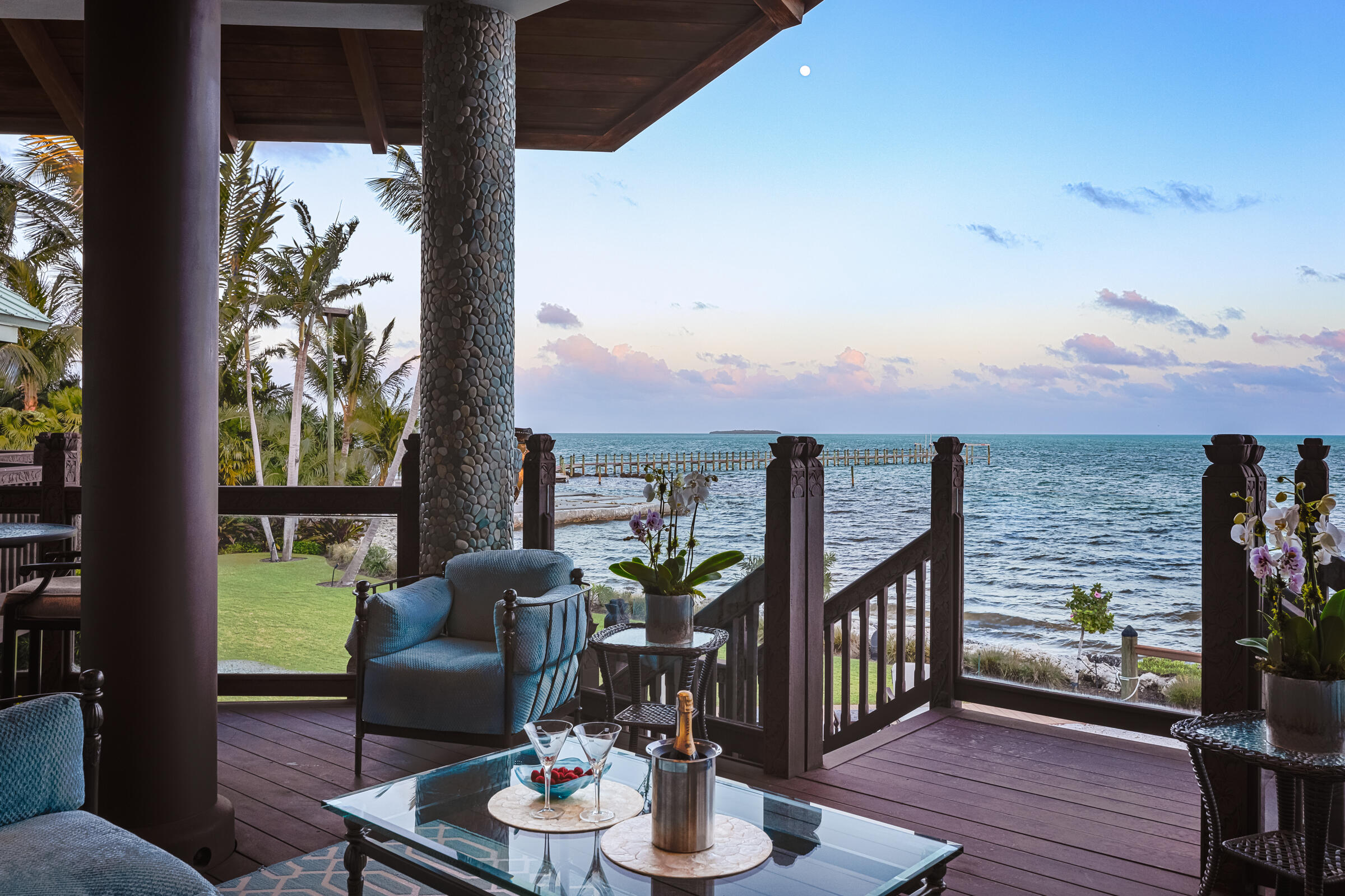 89301 Old State Road Tavernier, FL 33070 - Photo 42 of 99 a view of a balcony with chairs and wooden floor