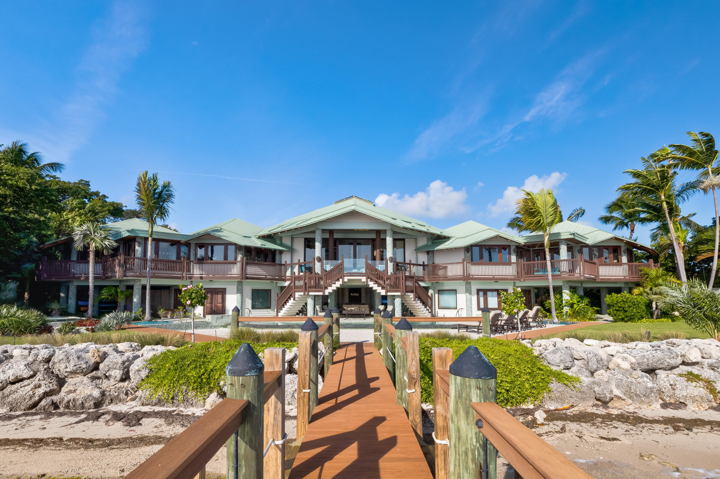 89301 Old State Road Tavernier, FL 33070 - Photo 47 of 99 a front view of a house with garden