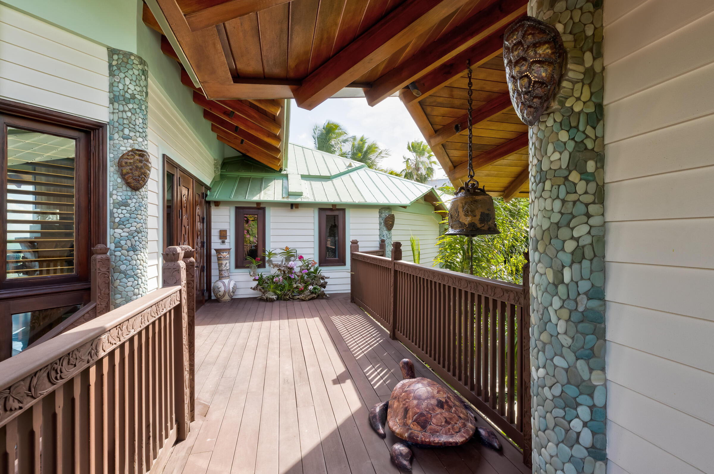 89301 Old State Road Tavernier, FL 33070 - Photo 71 of 99 a view of a porch with wooden floor and iron fence